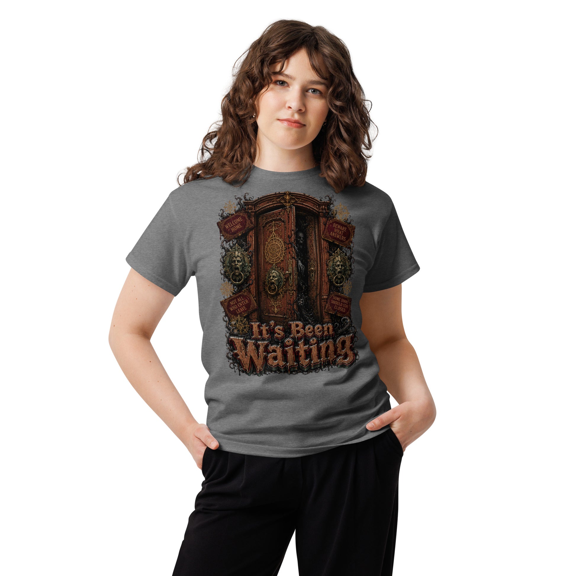 Horror and Mystery Lovers Unisex Classic Tee — "It's Been Waiting" Haunted Door and Creepy Entity Design by printfluence.net