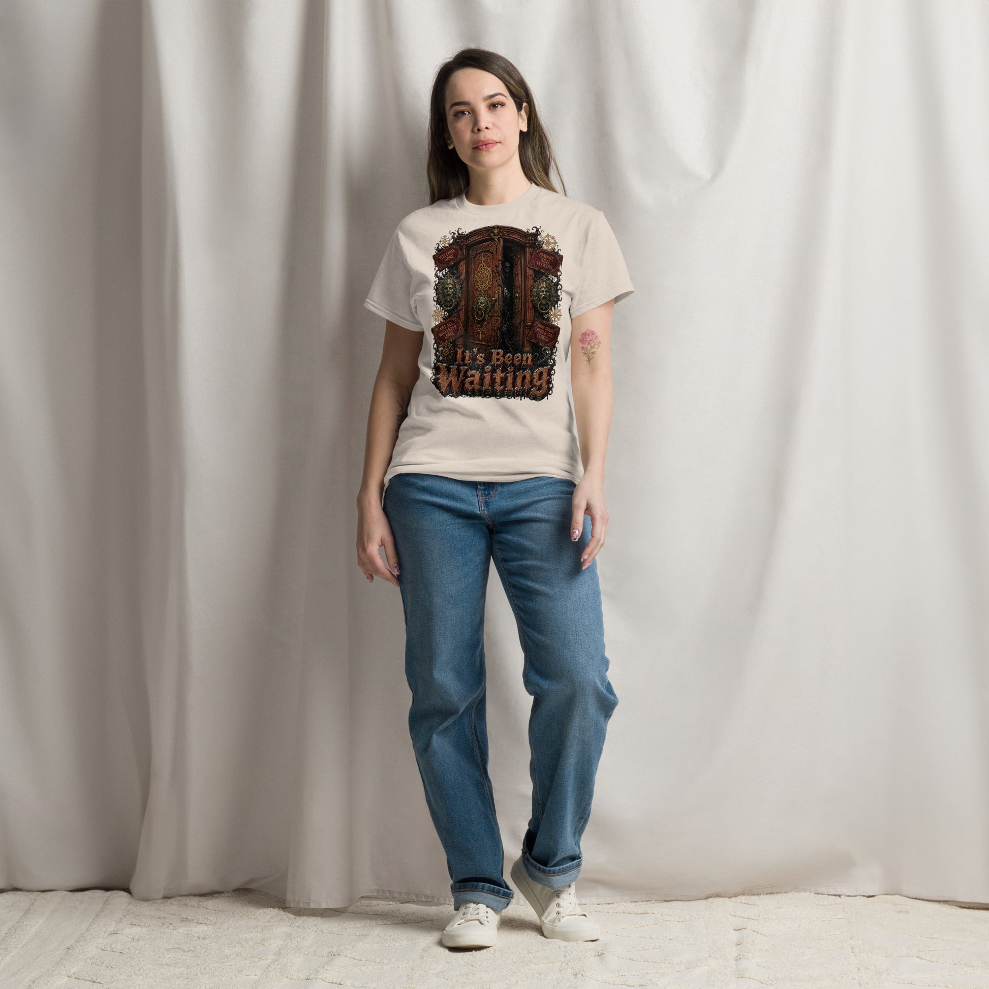 Horror and Mystery Lovers Unisex Classic Tee — "It's Been Waiting" Haunted Door and Creepy Entity Design by printfluence.net