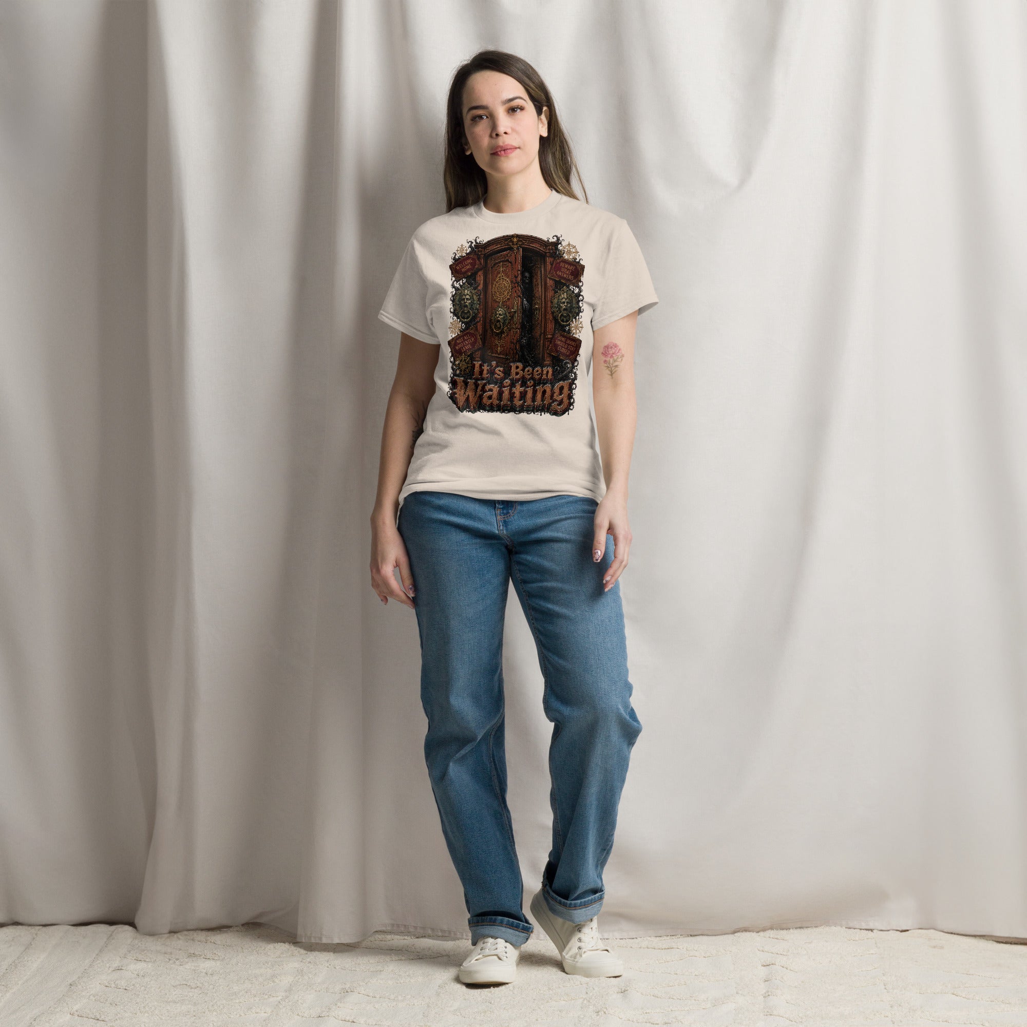 Horror and Mystery Lovers Unisex Classic Tee — "It's Been Waiting" Haunted Door and Creepy Entity Design by printfluence.net