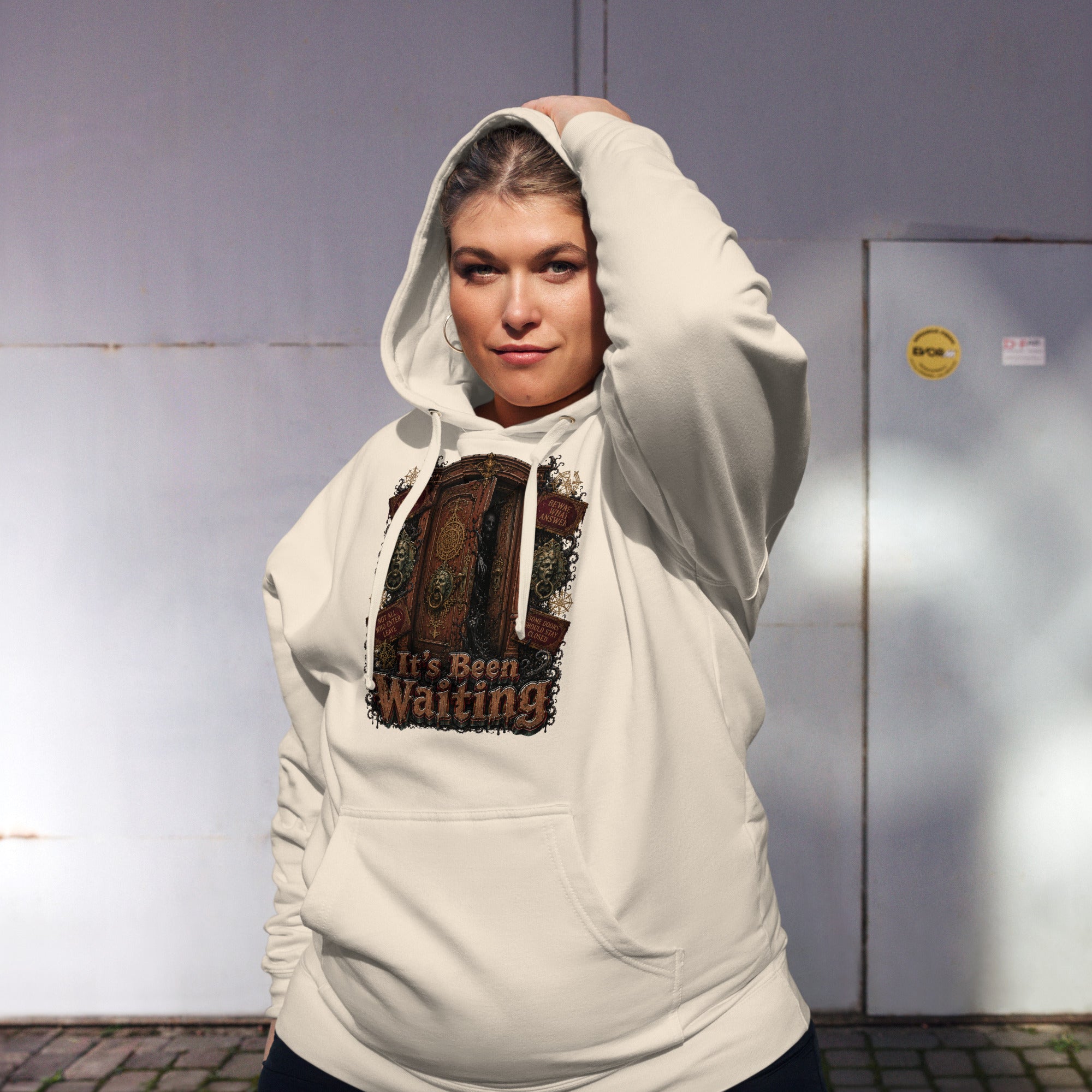Horror and Mystery Lovers Unisex Midweight Hoodie — "It's Been Waiting" Haunted Door and Creepy Entity Design by printfluence.net